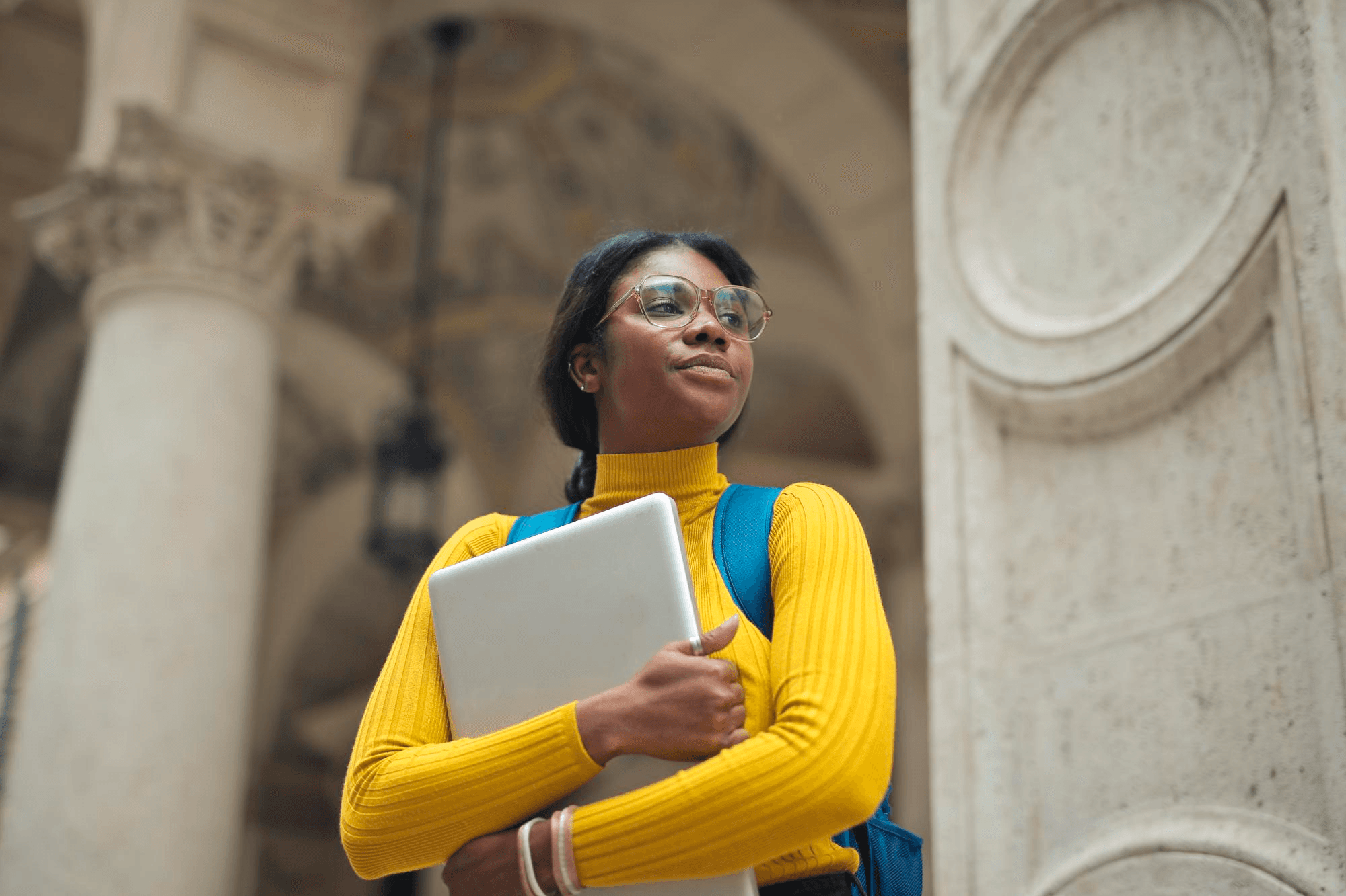 Confident student wearing sunglasses and yellow top